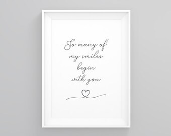 May include: Black and white printable wall art with the text "So many of my smiles begin with you" and a small heart.