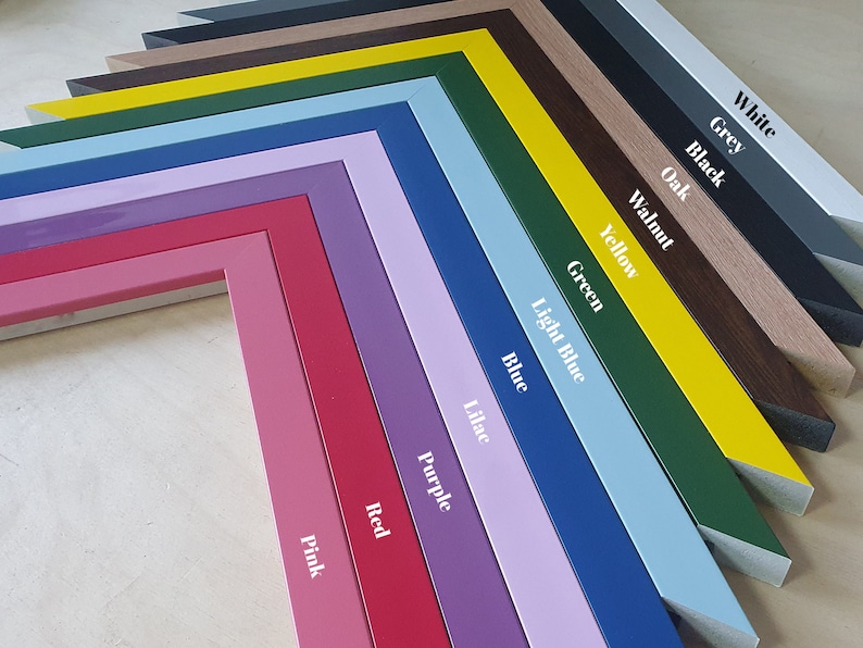May include: A collection of colorful picture frames in various shades, including pink, red, purple, blue, and green. Each frame is labeled with its color name in white text. The frames are arranged in a diagonal pattern, showcasing their different hues.