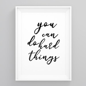 May include: Black and white printable wall art with the text "you can do hard things" in a cursive font.