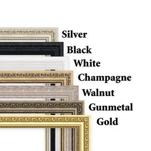 May include: A set of eight picture frames in different colors, including silver, black, white, champagne, walnut, gunmetal, and gold. The frames are all the same size and have a decorative, ornate design.