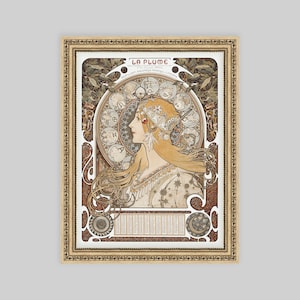 May include: A vintage art nouveau poster featuring a woman with flowing blonde hair and a crown of flowers. The poster is titled "La Plume" and features a decorative border with a calendar.