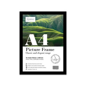 May include: Black A4 picture frame with a landscape photo of rolling green hills. The frame is almost frameless and has a white label that says "To hold 210mm x 297mm Photos, Prints, Certificates & Posters".