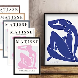 May include: Five framed prints of Matisse's "Papiers Decoupes" artwork. The prints feature a blue and a pink silhouette of a woman in a seated pose. The text "MATISSE Papiers Decoupes" is printed on each frame.