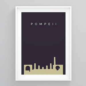 May include: A framed art print featuring a minimalist skyline silhouette in a light tan color against a dark purple background. The word "POMPEII" is printed in white at the top. The artwork is encased in a white frame.