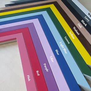 May include: A variety of picture frames in different colors, including pink, red, purple, lilac, blue, light blue, green, yellow, walnut, oak, black, grey, and white.
