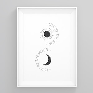 May include: Black and white printable wall art featuring a sun and moon design. The text reads "Live by the sun, love by the moon."