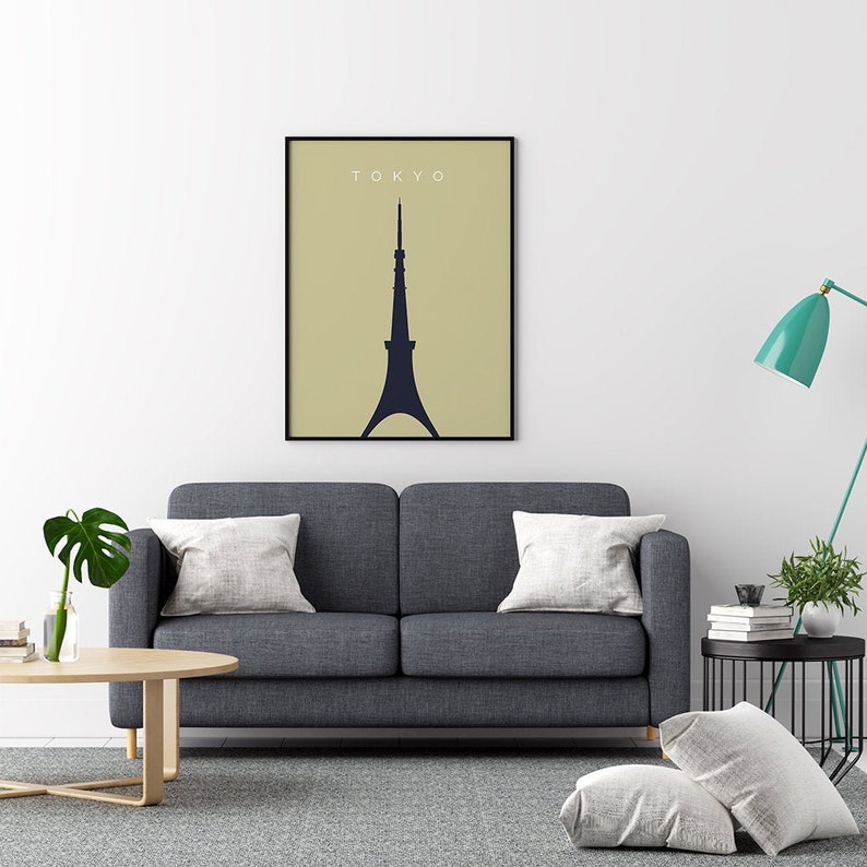 May include: A minimalist poster with a black silhouette of the Tokyo Skytree on a light beige background. The word "TOKYO" is printed in white at the top of the poster.