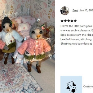 May include: Four handmade felt animal figures wearing knitted cardigans and a dress. The figures are standing on a pink and white patterned rug. The caption reads "Custom order for Bree / 4 items".