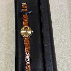 LC LE Chateau Ladies Watch Brown Leather Band Stainless Steel Genuine Diamond Japan Movement Good Condition Needs Battery. 18 kt gold plated