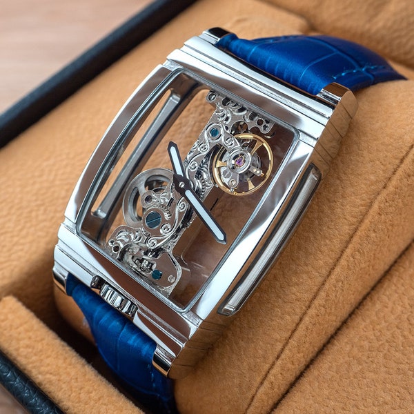 Mode personnalisée luxe squelette manuel mécanique squelette montre bijoux pièce de temps en Chrome argent bleu cuir déployant personnalisé