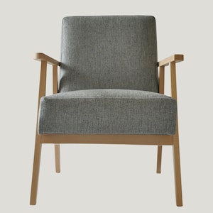 May include: A gray upholstered armchair with wooden legs and arms. The chair has a simple, modern design.