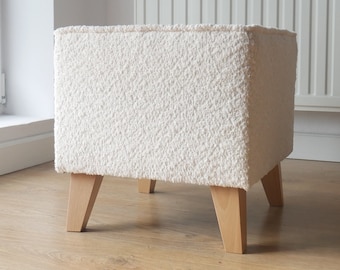 Minimalist upholstered stool with wooden legs, boucle fabric pouffe, armchair footrest  for a Cozy Living Space