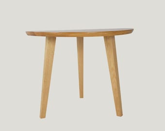 Minimalist solid oak coffee table with round top