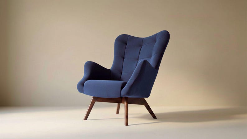 May include: A navy blue upholstered armchair featuring a high, tufted backrest, curved armrests, and a deep seat cushion. The chair is supported by four angled, dark brown wooden legs that provide a stable base for the seat structure.