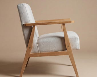 Cream armchair with oak armrests - minimalist comfort for any space
