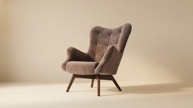 May include: A taupe-coloured armchair featuring a high, tufted backrest with a grid pattern, curved armrests, and a cushioned seat. The chair is supported by four angled, dark brown wooden legs that provide a stable base for the upholstered frame.