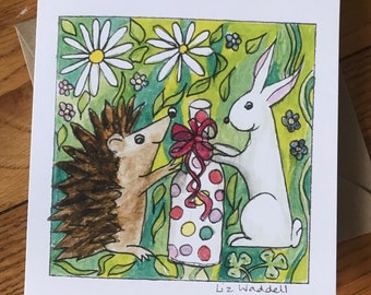 Hedgehog and rabbit card, hedgehog giving gift to rabbit card, rabbit, hedgehog and bottle of wine, from original painting by Liz Waddell