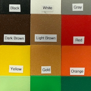 May include: A color palette featuring twelve distinct color swatches. The colors include black, white, gray, dark brown, light brown, red, yellow, gold, orange, light green, green, and dark green. Each color is labeled with a corresponding white rectangle.