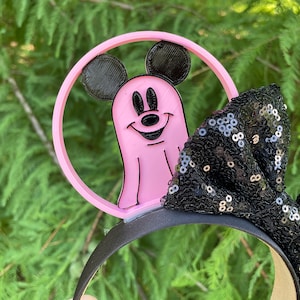 May include: Pink Mickey Mouse ghost Halloween headband with a black sequined bow.