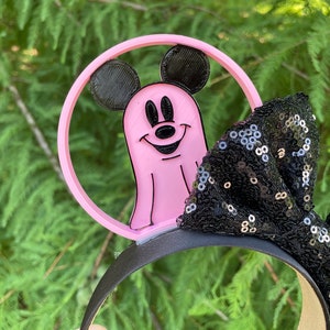May include: Pink Mickey Mouse ghost Halloween headband with a black sequined bow.