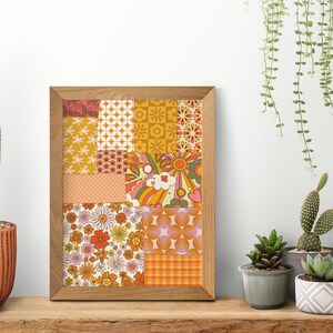 May include: A framed print with a patchwork design featuring various retro patterns in shades of orange, yellow, pink, and green. The patterns include flowers, geometric shapes, and abstract designs.