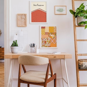 May include: A home office desk with a white chair, a wooden ladder shelf with plants, and artwork on the wall. The artwork includes a print with the text "Knit Happens" and a colorful patterned print.