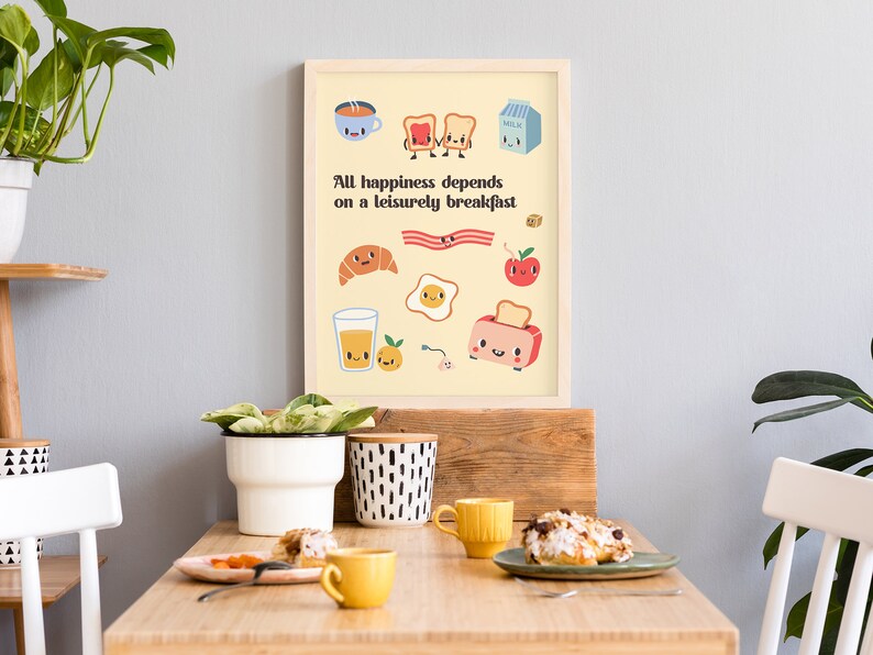 May include: A yellow poster with a quote about breakfast: "All happiness depends on a leisurely breakfast." The poster features cartoon illustrations of breakfast foods, including toast, eggs, bacon, a croissant, orange juice, and a toaster.