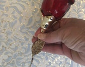 Vintage Avon courting rose holds lusciously scented before you go toilet bowl deodorizer. Looks lovely on toilet tank or vanity.