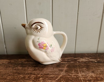 Lovely Small Porcelain Bird Pitcher with gold accents and flower Handpainted Details.