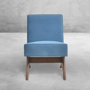 May include: A blue upholstered chair with a wooden frame and a simple, modern design.