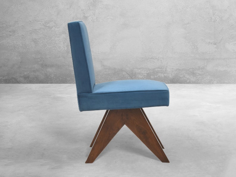 May include: A blue upholstered chair with a wooden base. The chair has a simple, modern design with a triangular base.