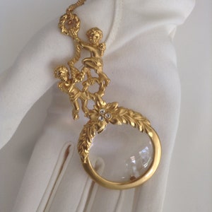Avon magnifying glass necklace store