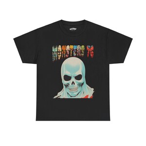 May include: Black t-shirt with a colorful "Monsters 76" graphic and a blue skull with a red and yellow background.