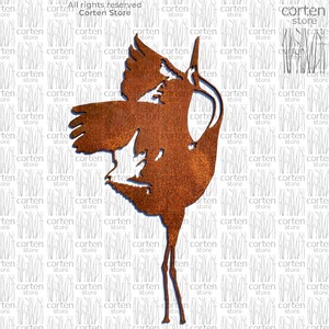 May include: A rusty metal sculpture of a crane with its wings spread. The sculpture is standing on a white background.