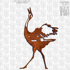 May include: A rusty metal sculpture of a crane with its head tilted back. The sculpture is standing on a white background.
