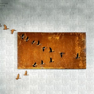 May include: A rusty metal wall art piece featuring a flock of geese flying in formation. The geese are cut out of the metal, creating a negative space design.