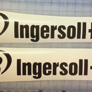 May include: Two white vinyl decals with the text "IR Ingersoll Rand" in black. The "IR" is in a black circle with a curved line. The decals are on a grid background.