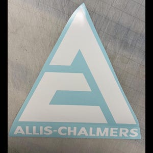 May include: White and light blue Allis-Chalmers logo sticker. The logo is a white triangle with a stylized "A" and the words "ALLIS-CHALMERS" in white lettering at the bottom. The sticker is on a light blue background.