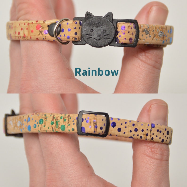 May include: A cork cat collar with a black cat-shaped buckle. The collar has a colorful polka dot pattern with blue, green, and purple dots on a beige background. The text "Rainbow" is printed on the collar.