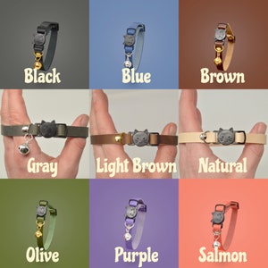 May include: Nine different colored cat collars with a cat-shaped charm and a bell. The collars are shown on a hand, with the color of the collar matching the background color. The colors are black, blue, brown, gray, light brown, natural, olive, purple, and salmon.
