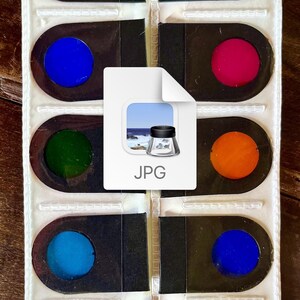 K&ouml;nnte beinhalten: Ein wei&szlig;er Kunststoffkoffer mit 10 runden Farbfiltern. Die Filter sind gelb, blau, gr&uuml;n, t&uuml;rkis, orange, rot, lila, magenta und zwei Oranget&ouml;ne. Der Koffer hat einen schwarzen Hintergrund und das Wort "JPG" ist auf der Vorderseite aufgedruckt.