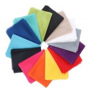 May include: A collection of 12 fabric swatches in various colors, including red, orange, yellow, green, blue, purple, and white. The swatches are arranged in a circle, with the edges of each swatch overlapping the next.