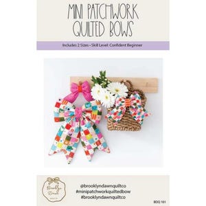 May include: A sewing pattern titled Mini Patchwork Quilted Bows featuring two sizes and a confident beginner skill level. The image displays colorful patchwork fabric bows, one solid pink bow, and a woven basket containing white flowers.