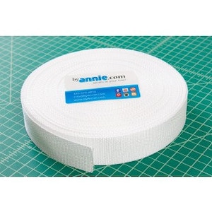 May include: A white roll of 1-inch wide hook and loop tape, also known as Velcro, with the text "byannie.com" printed on the label.