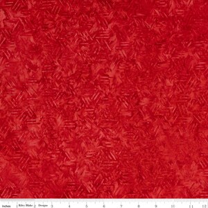 May include: Red fabric with a geometric pattern of overlapping triangles. The fabric has a textured, slightly distressed look.