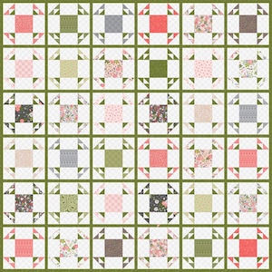 May include: A quilt block pattern with a variety of floral and geometric prints in shades of pink, green, gray, and brown. The blocks are arranged in a grid pattern and are surrounded by a green border.