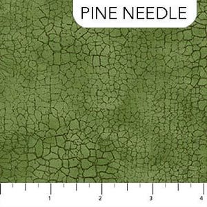 May include: Close-up of a green fabric with a cracked, textured pattern. The fabric has a dark green, almost olive, base color with darker green lines creating the cracked effect. The text "PINE NEEDLE" is in a white rectangle at the top.