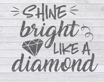 Peut inclure: Un design graphique gris sur un fond de bois blanc avec le texte "SHINE bright LIKE A diamond".