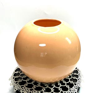 May include: A rustic wooden sign with the text "Welcome to our home" in white lettering. The sign features a distressed finish and a simple, inviting design, perfect for a front porch or entryway.