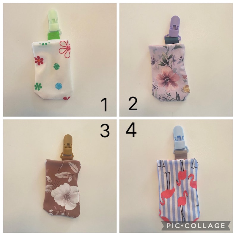 May include: Four fabric pacifier clips with different patterns. The patterns include flowers, floral, and flamingo designs. Each clip has a plastic clip at the top.